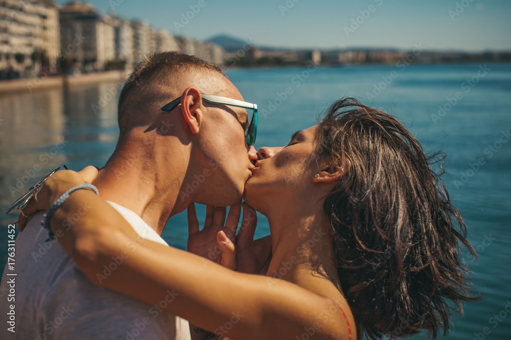 Man and woman kissing. Just one kiss. Lovers. Man sunglasses. Love story.  Vacation, travel. Stock Photo | Adobe Stock