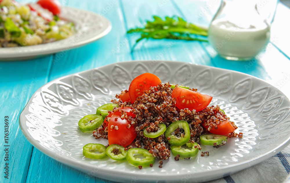 Plate with quinoa salad on table, closeup Plate with quinoa salad on table, closeup