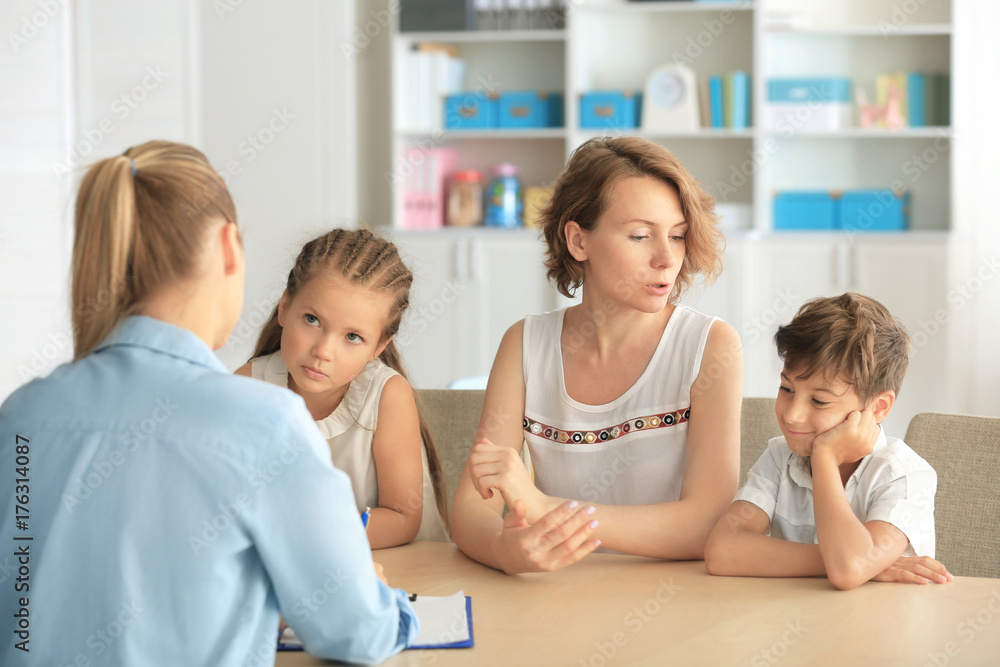 Young child psychologist working with family in office Young child psychologist working with family in office