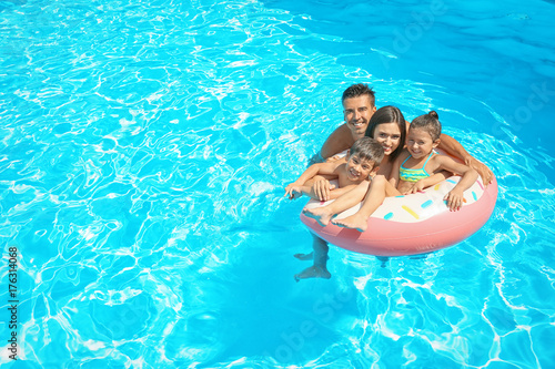 Happy family with inflatabl...