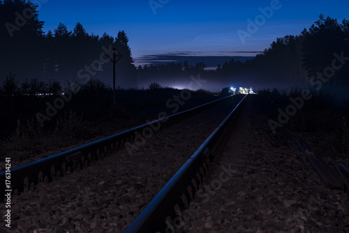 Railway leading to railroad maintenance work done in the night 
