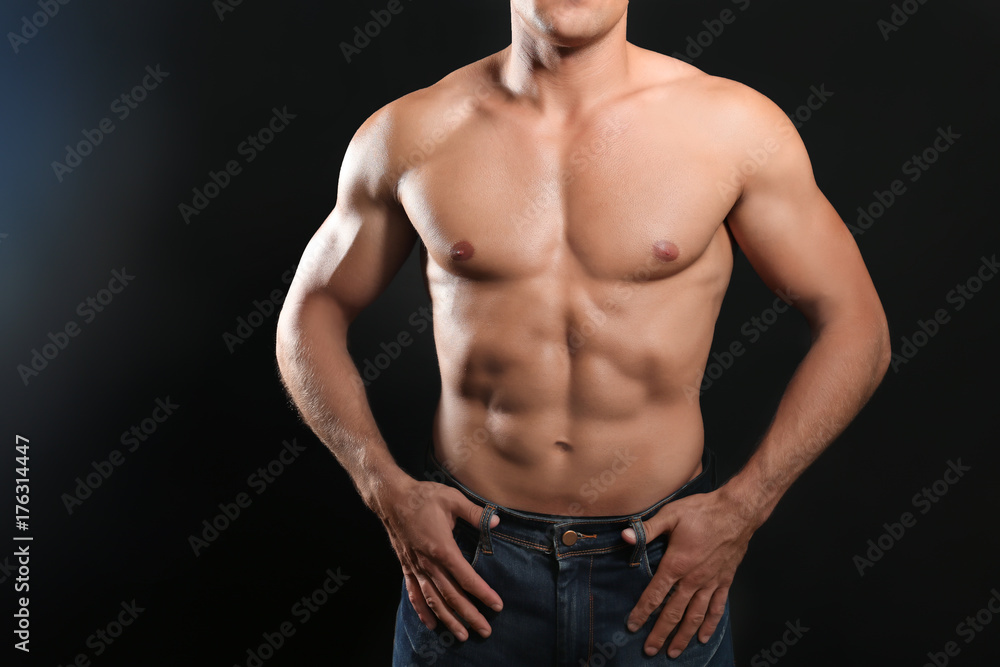 Muscular man on dark background