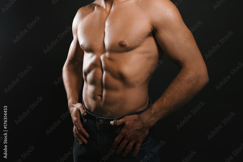Muscular man on dark background