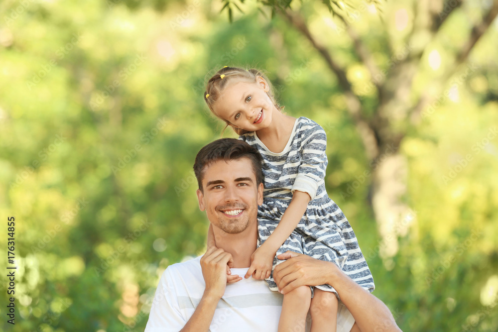 Father with daughter in park on sunny day Father with daughter in park on sunny day