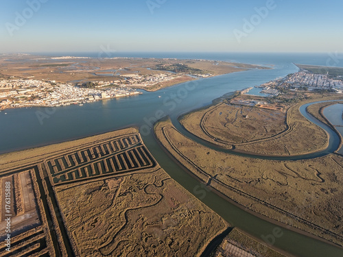 Aerial. Textured fields of swampy salt lakes. Vila Real Santo Antonio. photo