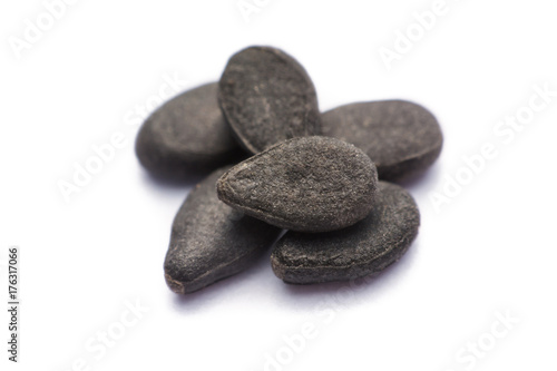 Close up pile of black sesame seeds isolated on white background