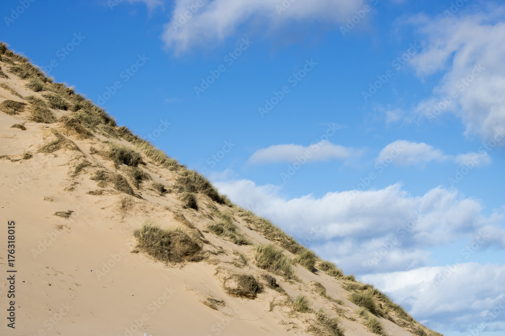 Grassy Sand Dunes at Newburgh Beach in front of Blue Sky