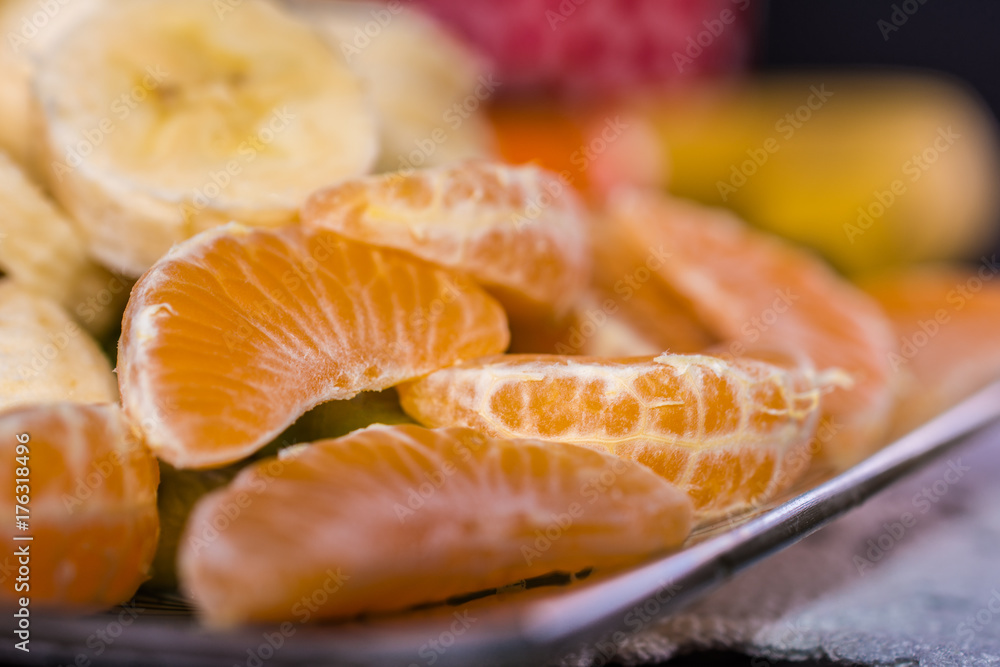 Mandarin slices at the plate.Close-up shoot with shallow depth of field