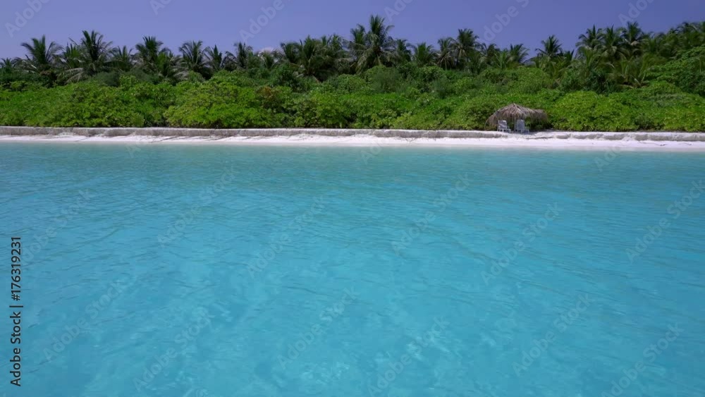 Tropical island at maldivian atoll in Indian Ocean. Travel destinations Tropical island at maldivian atoll in Indian Ocean. Travel destinations
