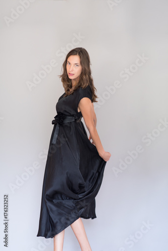 woman in a black dress isolated on white background