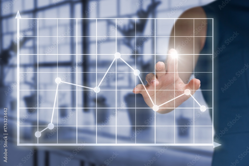 Composite image of midsection of woman touching virtual graph Composite image of midsection of woman touching virtual graph