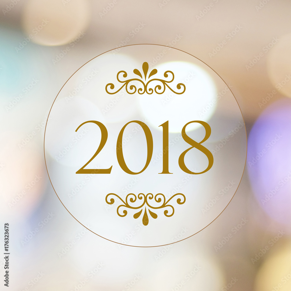 Obraz premium 2018 on blur abstract bokeh background, new year greeting card, banner