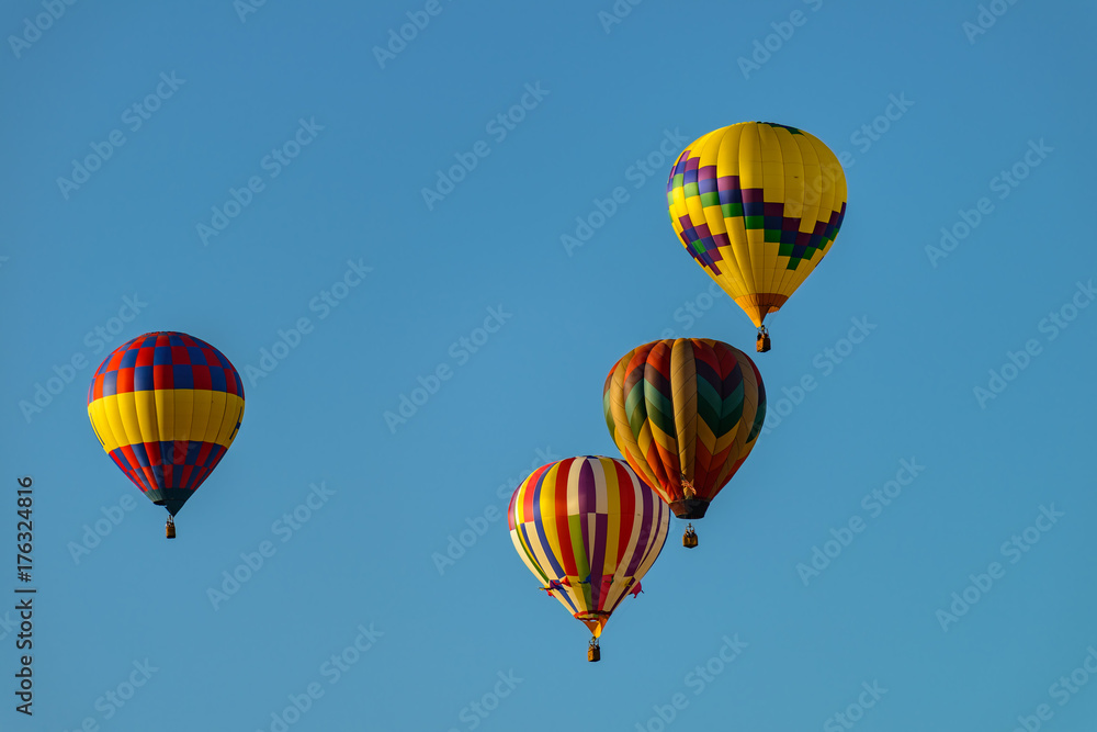 Colorful hot air balloons against blue sky Colorful hot air balloons against blue sky