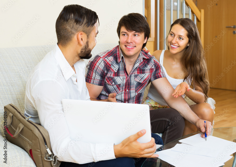 Fototapeta premium Positive couple and salesman talking