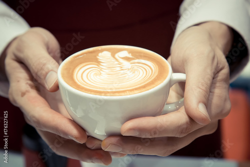 Barista Holding The Cup Of Coffee Service Concept
