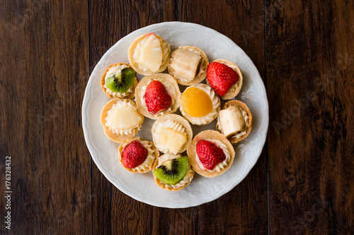 Mini Tarts, Tartolet or Tartlets with cream and fresh fruits