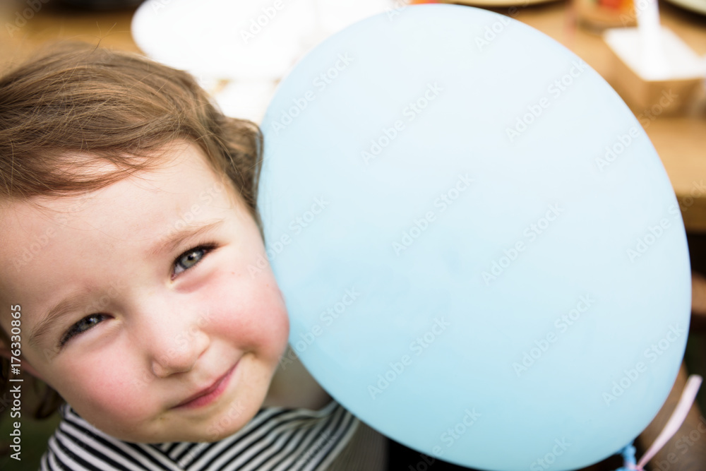 Kid enjoying party in the backyard