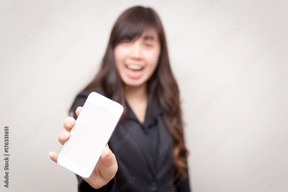 Happy confident businesswoman show her smartphone. concept for business and communication. Happy confident businesswoman show her smartphone. concept for business and communication.