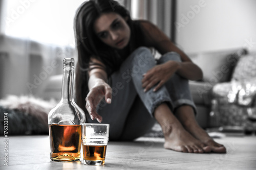 Drunk woman reaching after ...