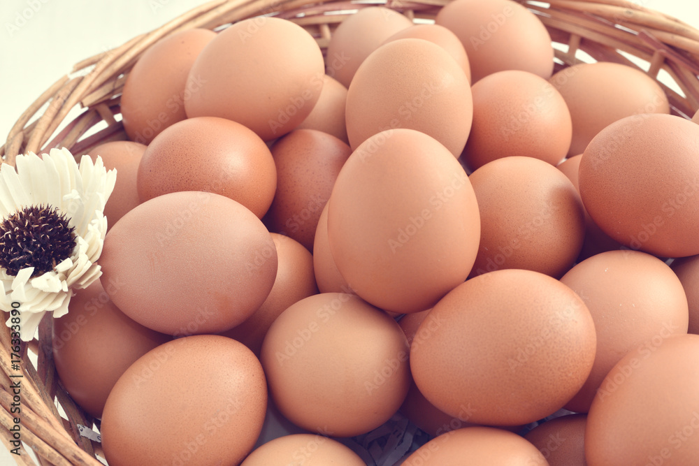 eggs in basket filled isolated on white background. eggs in basket filled isolated on white background.