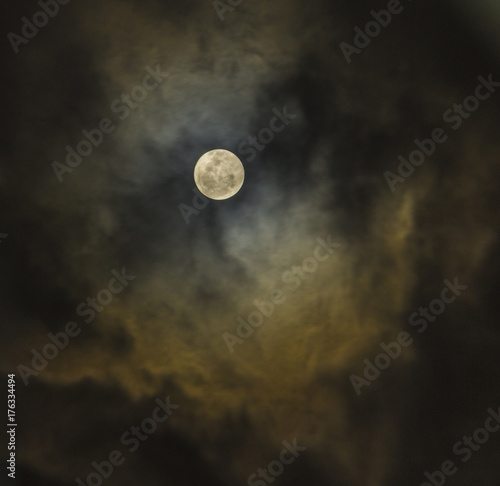 Moon on a cloudy night sky