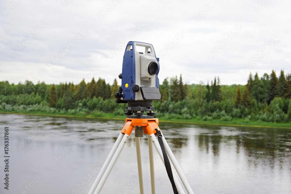 Modern electronic tachymeter mounted on tripod