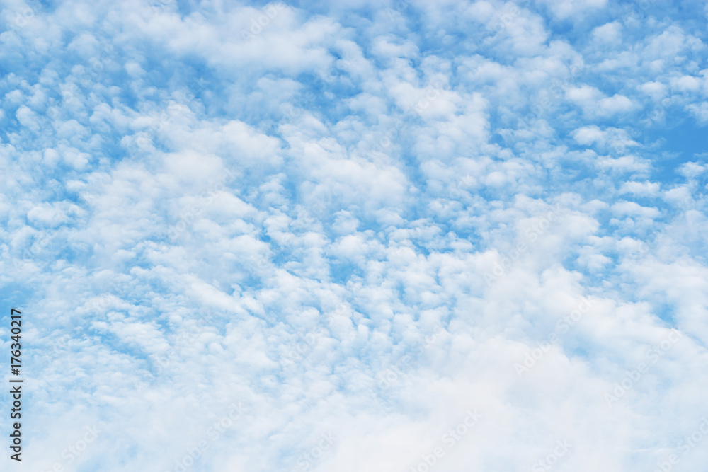 Fluffy small clouds on blue sky background Fluffy small clouds on blue sky background