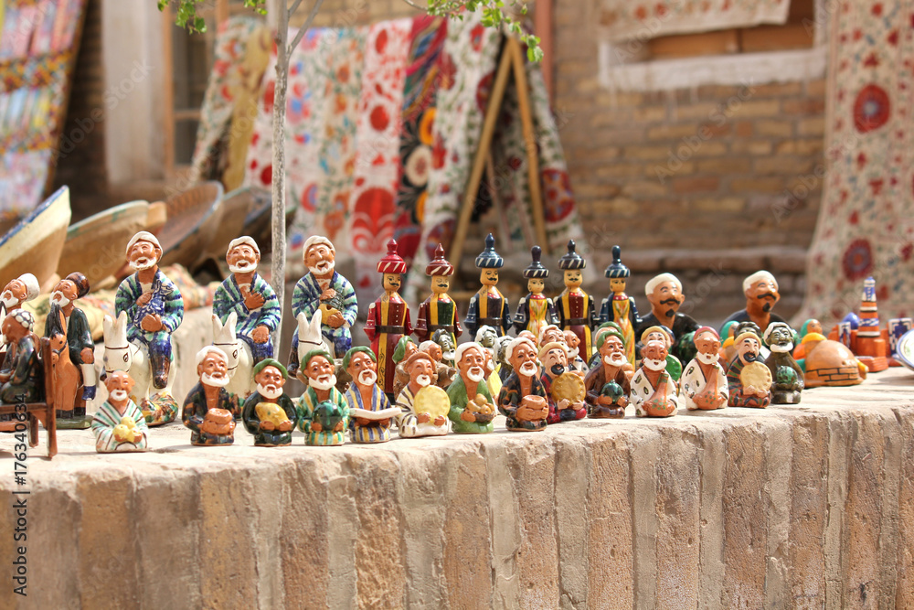 the showcase with Uzbek Souvenirs, ceramic figurines of people, in Khiva