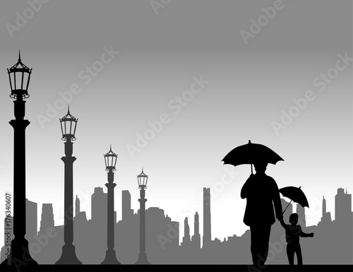 Grandmother walking with her grandson under the umbrellas on the street, one in the series of similar images silhouette