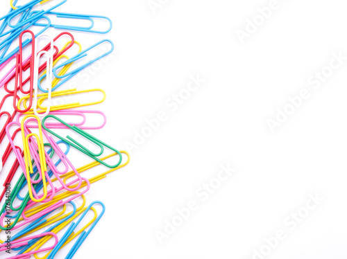 Colorful paper clips on white background and copy space