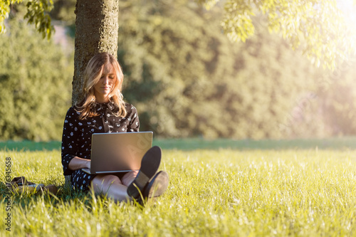 Woman portrait at summer sunset at the park in Verona