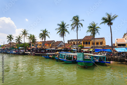 Bach Dang wharf at Hoi An Ancient Town, Quang Nam, Vietnam. Tourist can get on a boat to explore a whole lot more of Hoi An, Thu Bon river and the delta. © tranquocphongvn