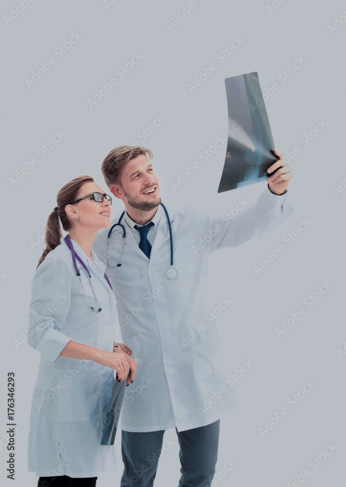 A group of doctors examining an x-ray in the hospital A group of doctors examining an x-ray in the hospital