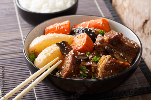 Galbi jjim Korean Braised Beef Short Ribs with rice close-up. Horizontal photo