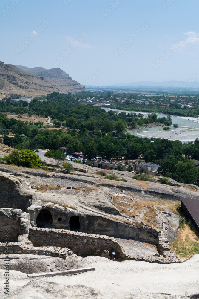 Underground ancient  town of Uplistsikhe and panoramic view to Kura river dale on background, Georgia