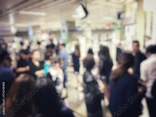 blurred image of asian people on the queue line on rush hour waiting for train subway station. Stay in the crowd cause stress in everyday life and jeopardize people health. Transport concept