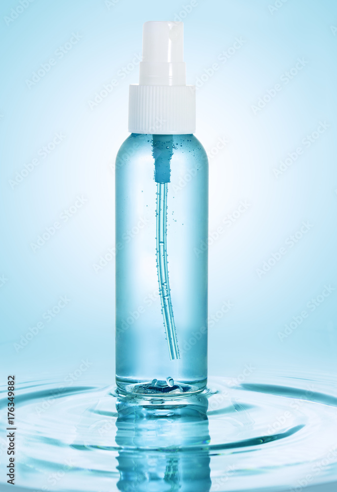 lotion spray bottle on water ripple lotion spray bottle on water ripple