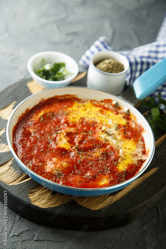 Eggs with spices, herbs and tomato sauce Eggs with spices, herbs and tomato sauce