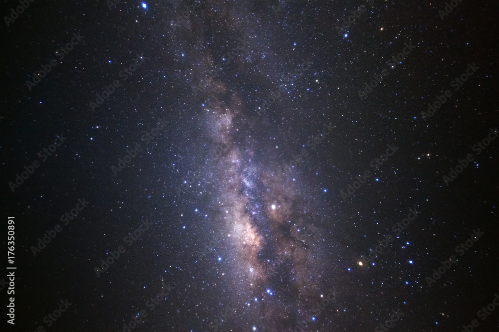Fototapeta premium Milky way galaxy with stars and space dust in the universe, Long exposure photograph, with grain.