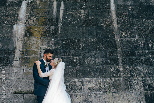 A beautiful couple of brides walking outside photo