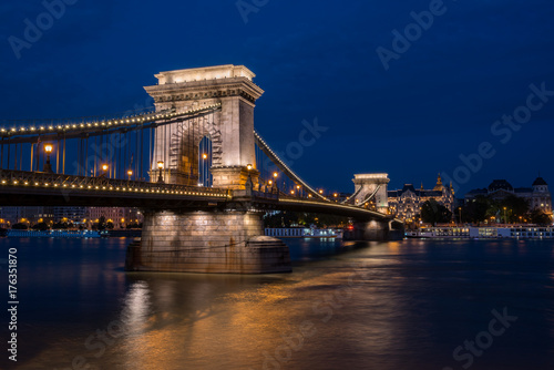 Beautiful night shot of the illuminated Chain Bridge in Budapest across the Danube river in Hungary.