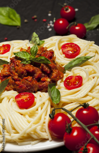 Closeup of delicious spaghetti Bolognaise or Bolognese with savory minced beef and tomato sauce.