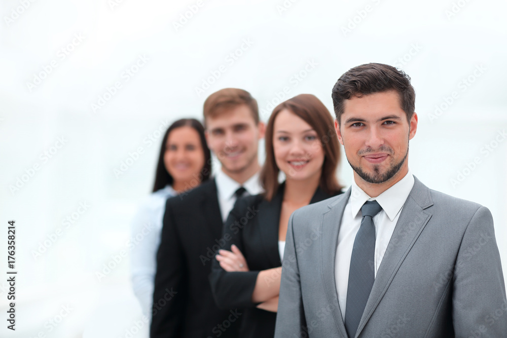 leader and the business team standing one behind the other. leader and the business team standing one behind the other.