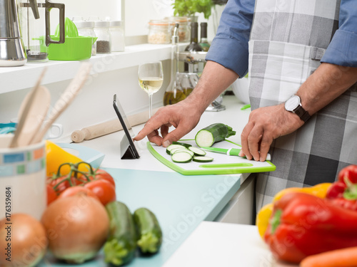 Man cooking and learning new recipes