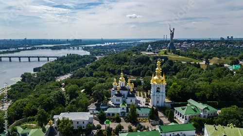 Aerial top view of Kiev Pechersk Lavra churches on hills from above, cityscape of Kyiv city, Ukraine 