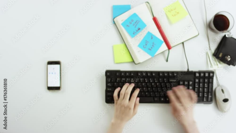 Top down shot of man shopping online and calling to shop Top down shot of man shopping online and calling to shop