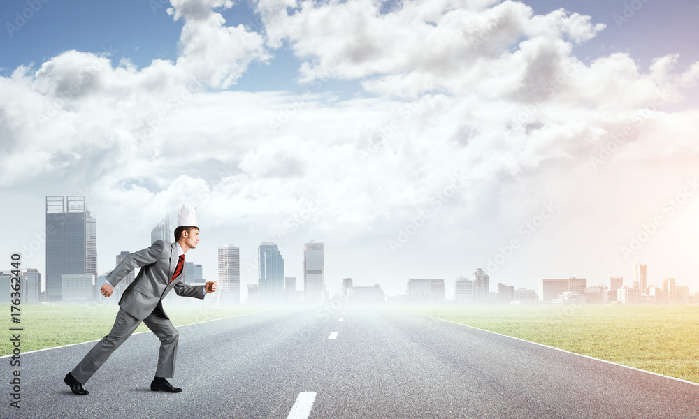 King businessman in elegant suit running and business center at background King businessman in elegant suit running and business center at background