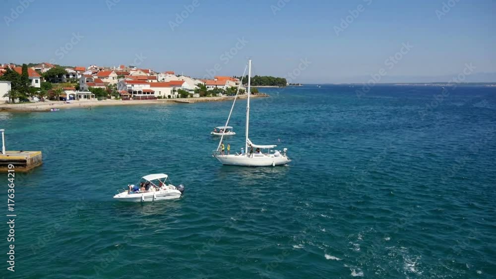 PREKO, CROATIA, 12.8.2017: Boats waiting for their turn for filling up fuel. Slow-motion-hd. PREKO, CROATIA, 12.8.2017: Boats waiting for their turn for filling up fuel. Slow-motion-hd.