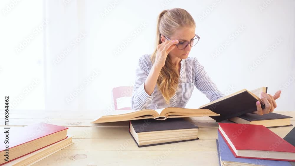 pretty girl getting ready for the exam at the library pretty girl getting ready for the exam at the library