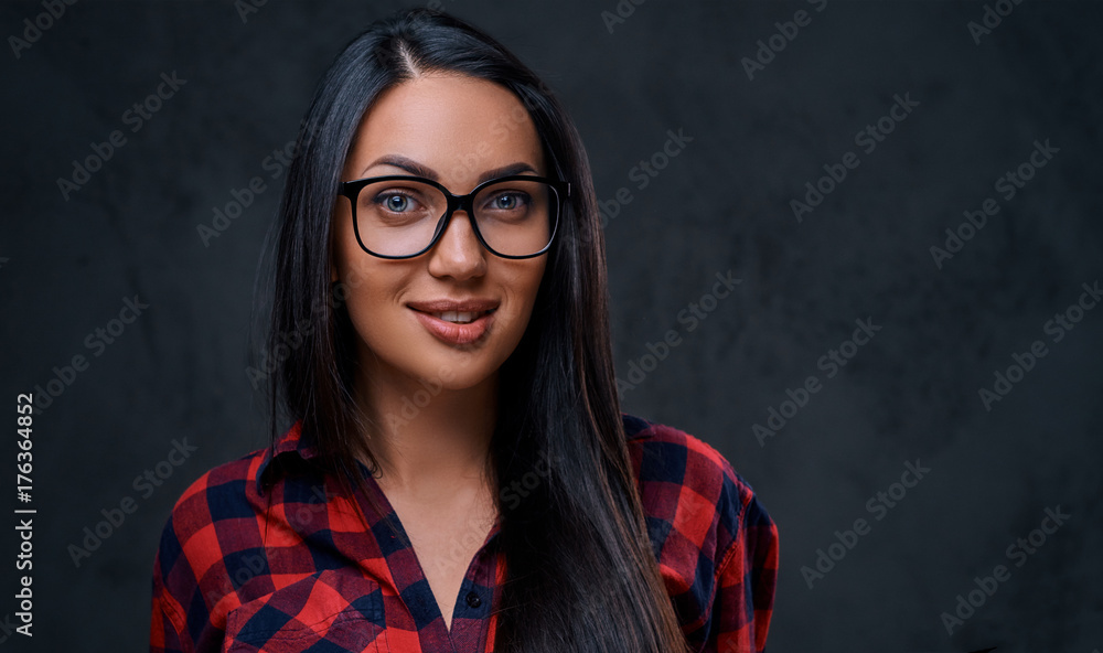 A woman dressed in a red shirt over grey background. A woman dressed in a red shirt over grey background.